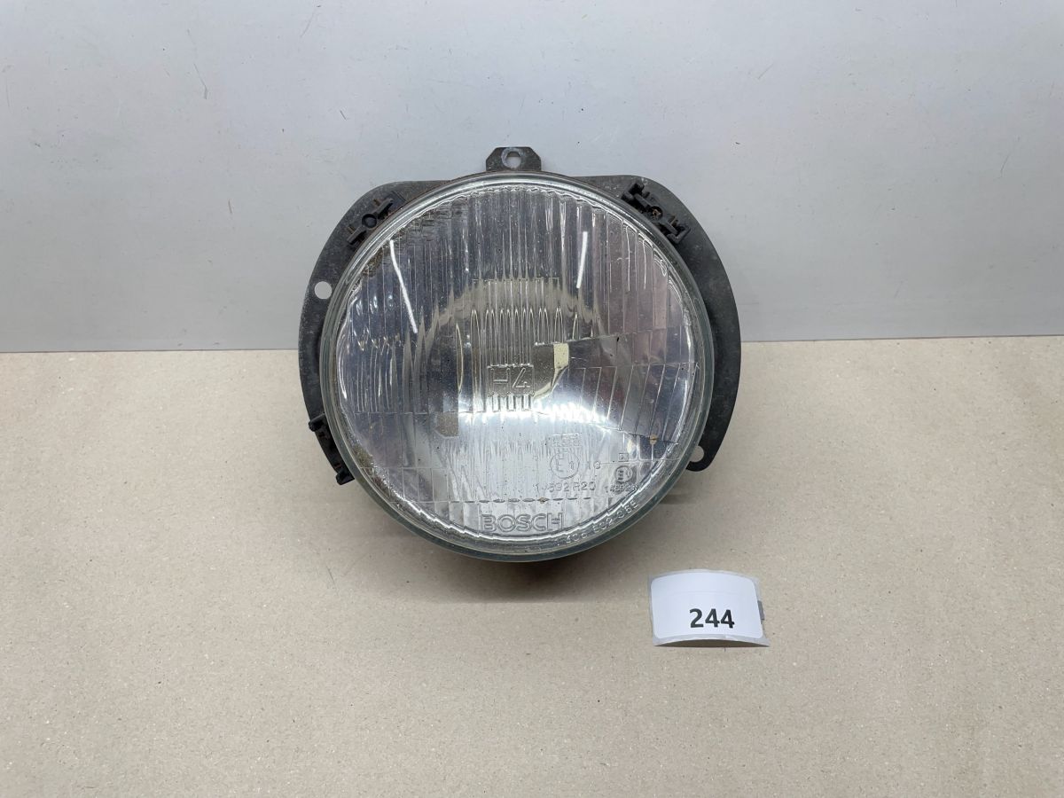 Bosch Scheinwerfer H4  1 305 602 068 1305602068 -  VW Polo Audi  (102-1)